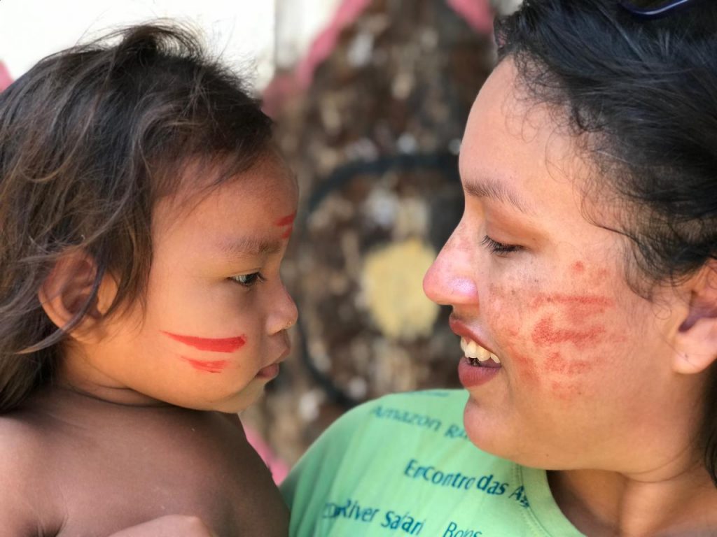 Amazon Experiences like in the photo where a woman with a indigenous tatuyo child in the amazonia