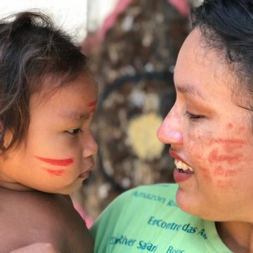 Amazon Experiences like in the photo where a woman with a indigenous tatuyo child in the amazonia
